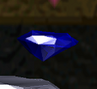 A Blue Gem in Crash Bandicoot 2: Cortex Strikes Back seen in the pause menu