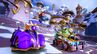 Spyro racing on his home track, Spyro Circuit, with Gnasty Gnorc and Crash.