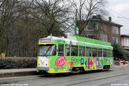 Suti's face on the side of a tram in Europe, during a promotion