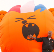 C1000 employee posing with the inflatable