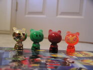 Moshi next to Bugui, Mosh, and Gold Mosh figures (right to left).