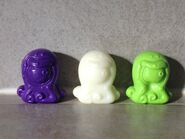 This image shows three different variants of Eyesore; one standard, one glow in the dark, and one slightly malformed 'gooey' bone.