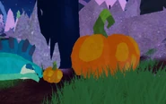 A pumpkin, which may be a resource requirement for the Jack-o'-lantern. It can be acquired by breaking some decorative pumpkins around the map