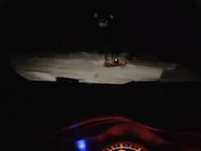 Photo of the creature.png (309 KB) A photo taken by a driver of Prototype Fredbear looking back at them.