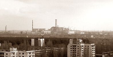 View of Chernobyl taken from Pripyat zoomed.jpg