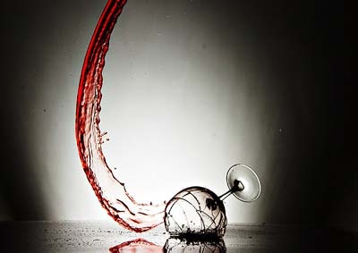 broken wine glass on floor