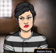 Madam Xiang, wearing the prison uniform.