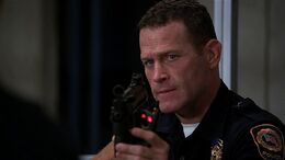 Luke holds the BAU headquarters at gunpoint.