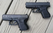 A Glock 26 (bottom) compared to a Glock 43.