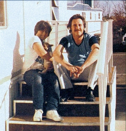 A younger Phillips with his father.