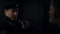 A FSB AG operator draws his Glock 19 against Oleg Antakov in "The Ripper of Riga".