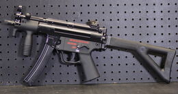 An MP5K with an extended stock.