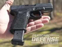 Glock 19 extended mag.jpg (48 KB) A Glock 19 with an extended magazine being held.