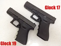 A Glock 17 (top) and Glock 19 (bottom).