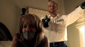 Graney holding Shelly at gunpoint.