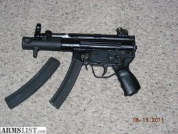 An MP5K with an extra magazine.