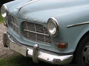 Closeup of the front bumper, headlights, and grille on a '65 Volvo Amazon