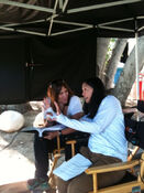 "Director Karen Gaviola going over a shot with Scripty Liz on the first day of shooting for 7x02 "Proof"" CM Writers Twitter July 18, 2011