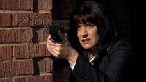 Prentiss wielding Reid's Glock 17 in "Elephant's Memory".