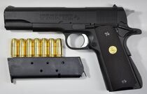 An M1911 with a 7-round magazine.