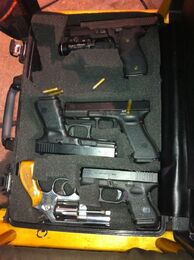 A case full of prop weapons used on Criminal Minds, including a S&W 65 revolver.