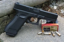A Glock 17 and a box of ammo.