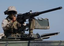 An M2HB on a vehicle with a soldier.