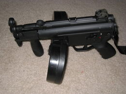 An MP5K with a Beta C-Mag attached.