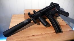 An MP5K with a suppressor attached.