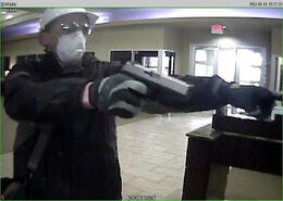 Israel Keyes committing a robbery with a .40 S&W pistol.