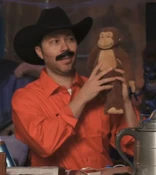 Sam as Burt Reynolds in Smokey and the Bandit from "Stoke the Flames" (1x30).[art 5]