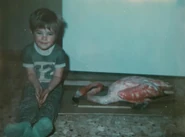 The dead flamingo found in Newfoundland, seen next to the hunter’s son