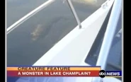 Champ swimming by a boat caught on video.