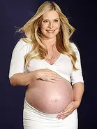 E2.webp (18 KB) Procter holding her growing womb and on set of her shoot for Palmer's Cocoa Butter Formula.