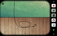 An extra item, in this case a green gem, outside the inventory in Cube Escape: The Lake.