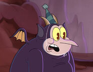 Henchman in "Sweater Off Dead", wearing a party hat.