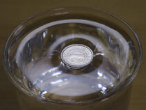 Surface tension - Japanese 1 Yen alminium coin on water