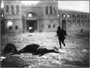 A lone soldier charges a UGO held building during fierce fighting on the border of the LSF commune Heim and the nation of 