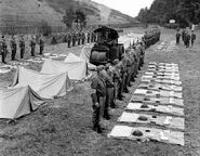 The out-of-control steam roller flattens the platoons' tents.