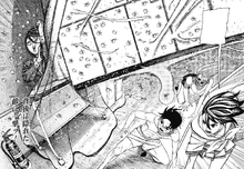 Momo knocking Koki out by crushing her with a cooking counter.