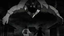 The Flatwoods Monster showing himself to Momo and Okarun.