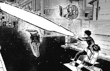 Okarun bisecting Mr. Dris with an enlarged Oni Club.