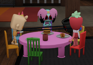 Twisted Poppy, Twisted Finn along with Sprout, Scraps and Goob standing around a table in the Toon Rooms map