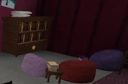 A corner of Brightney's room with 3 beanbags and a bookcase, presumably where Brightney hosts her book club with Dazzle and Astro