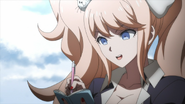 Junko does her Monokuma laugh as she finishes sketching her design for him.