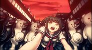 Komaru surrounded by the Monokuma units.