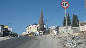 Zoldan Monument Right to entrance to Al Funduq