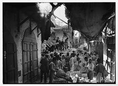 The earthquake of July 11, 1927. Blocked-up street in Nablus, choked by fallen houses which entombed many inhabitants