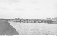 הגשר ביציאה הדרומית מבאר שבע - Shellal, Palestine. 1917-10. The drawbridge over Wady Ghuzze being crossed by a camel train.