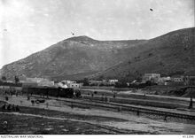 תחנת הרכבת בשכם - Nablus, Palestine. c. 1917. A train standing at the station with steep hills in the background. (Donor Imperial War Museum Q15214)